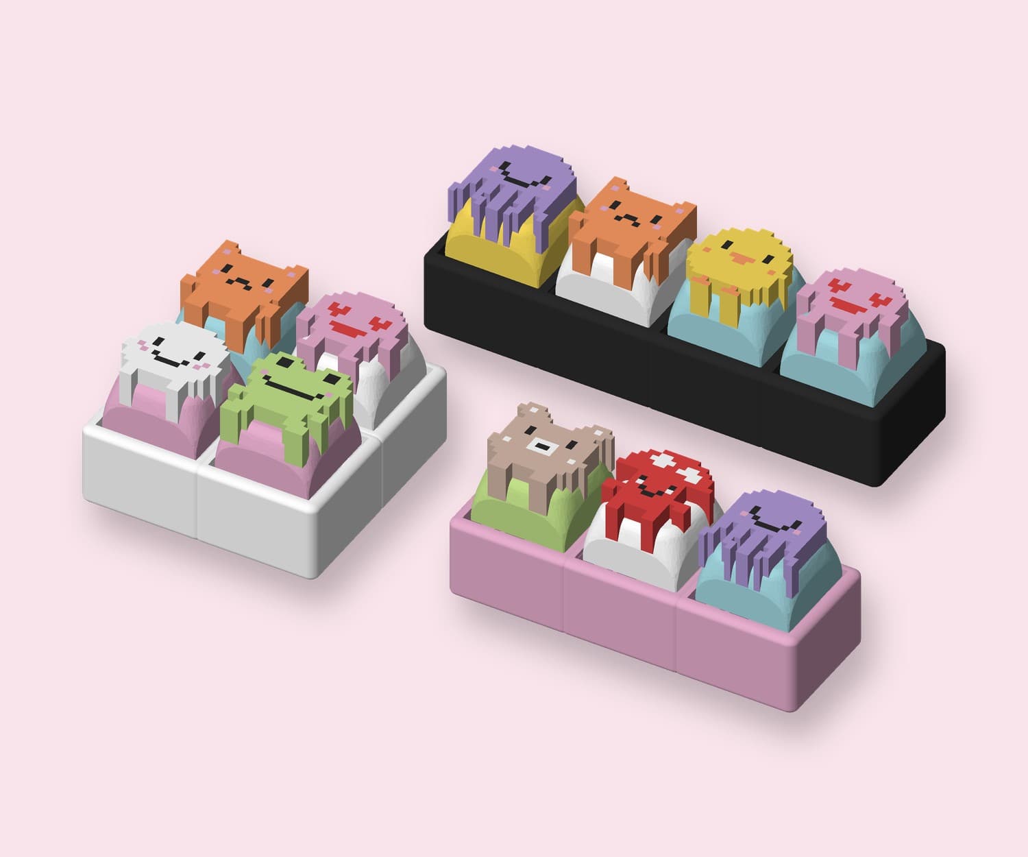 A white 2×2, a pink 1×3 and a charcoal 1×4 clicker, each filled with critter keycaps